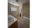 Bathroom features tile flooring, toilet, shower/tub, and a single sink vanity at 2604 Webster St, North Las Vegas, NV 89030