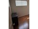 Bedroom with hardwood flooring has natural light from window with blinds at 2604 Webster St, North Las Vegas, NV 89030