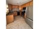 The kitchen features granite countertops, a stainless refrigerator, and black appliances at 2604 Webster St, North Las Vegas, NV 89030