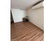 Living room has hardwood floors, air conditioning unit, and a small storage unit at 2604 Webster St, North Las Vegas, NV 89030