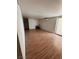 The living room offers ample natural light and wood-look flooring at 2604 Webster St, North Las Vegas, NV 89030