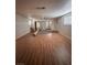 Spacious living room features hardwood floors, a ceiling fan, and natural light at 2604 Webster St, North Las Vegas, NV 89030