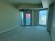 Bedroom with city views through floor-to-ceiling windows and private balcony at 2700 Las Vegas Blvd # 2811, Las Vegas, NV 89109