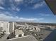Wide city view from a high vantage point, capturing diverse architecture and distant mountain ranges under a blue sky at 2700 Las Vegas Blvd # 2811, Las Vegas, NV 89109