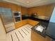 Close-up showcasing stainless steel appliances and granite countertops with wood cabinetry at 2700 Las Vegas Blvd # 2811, Las Vegas, NV 89109