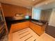 Well-lit kitchen with granite countertops and wood cabinets providing ample storage space at 2700 Las Vegas Blvd # 2811, Las Vegas, NV 89109