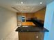 Gourmet kitchen with stainless steel appliances, granite countertops, and wood cabinetry at 2700 Las Vegas Blvd # 2811, Las Vegas, NV 89109