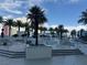 Resort-style pool area with palm trees, lounge chairs, and cascading water features at 2700 Las Vegas Blvd # 2811, Las Vegas, NV 89109