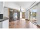 Elegant dining area with tile floors, a chandelier, and views of the city through large windows at 2857 Paradise Rd # 301, Las Vegas, NV 89109