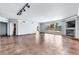 Expansive living room featuring tile floors, a fireplace, and a wall of windows with access to a private balcony at 2857 Paradise Rd # 301, Las Vegas, NV 89109