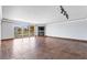 Open living space with tile floors, a fireplace, and sliding glass doors to a balcony with views of palm trees at 2857 Paradise Rd # 301, Las Vegas, NV 89109