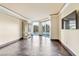 Stylish living room with wood floors, floor-to-ceiling windows, and a large TV at 2857 Paradise Rd # 301, Las Vegas, NV 89109