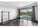Cozy office space with wood floors, a desk, and sliding glass doors that lead to a balcony at 2857 Paradise Rd # 301, Las Vegas, NV 89109