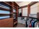Spacious walk-in closet featuring custom shelving, drawers, and ample hanging space for organized storage at 2877 Paradise Rd # 906, Las Vegas, NV 89109