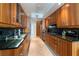 Well-lit kitchen with granite countertops and wooden cabinets, offering ample counter space at 2877 Paradise Rd # 906, Las Vegas, NV 89109