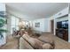 Spacious living room with a plush sofa, entertainment center, and ample natural light at 2877 Paradise Rd # 906, Las Vegas, NV 89109