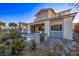 Outdoor kitchen and private splash pool in backyard with mature landscaping and a covered patio at 30 Hilltop Crest St, Henderson, NV 89011