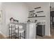 Stylish bar area with modern bar stools, granite countertops, and floating shelves, perfect for entertaining at 30 Hilltop Crest St, Henderson, NV 89011