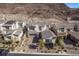 Beautiful two-story home with a neutral color palette, landscaping, and mountain views at 30 Hilltop Crest St, Henderson, NV 89011