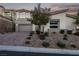 Beautiful home with a well-maintained front yard and a paved driveway leading to a two-car garage at 30 Hilltop Crest St, Henderson, NV 89011
