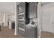 Gray kitchen cabinets featuring stainless steel appliances, microwave and oven combination at 30 Hilltop Crest St, Henderson, NV 89011