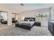 This bedroom features new carpet, a queen-sized bed, and double closets with mirrored doors at 3047 Van Buskirk Cir, Las Vegas, NV 89121