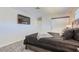 A well-lit bedroom features a rustic wooden bed frame, a TV and sliding closet door at 3047 Van Buskirk Cir, Las Vegas, NV 89121