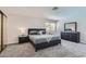 This stylish bedroom features a gray bed, matching nightstands, and a dresser with a large mirror at 3047 Van Buskirk Cir, Las Vegas, NV 89121