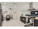 Open-concept kitchen with an eat-in dining area and seamless connectivity to the living spaces at 3047 Van Buskirk Cir, Las Vegas, NV 89121