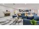 Inviting living room with a cozy fireplace, comfortable seating, and open layout, perfect for relaxing and entertaining at 3047 Van Buskirk Cir, Las Vegas, NV 89121