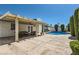 Inviting poolside patio with ample seating, complemented by lush greenery and a pristine swimming pool at 3047 Van Buskirk Cir, Las Vegas, NV 89121