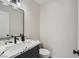 This powder room features a modern vessel sink on a dark vanity with a marble countertop at 3047 Van Buskirk Cir, Las Vegas, NV 89121