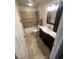 Well-lit bathroom features shower-tub combo with dark wood vanity at 3278 Liahona Way, Las Vegas, NV 89121