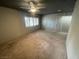 Carpeted bedroom with dark ceiling, ceiling fan, and two doors at 3278 Liahona Way, Las Vegas, NV 89121