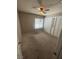 Carpeted bedroom featuring ceiling fan, large window, and built-in closet at 3278 Liahona Way, Las Vegas, NV 89121
