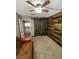 Cozy bedroom features stylish barn door accent wall and ceiling fan at 3278 Liahona Way, Las Vegas, NV 89121