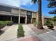 Inviting townhomes with desert landscaping, and a large palm tree at 3278 Liahona Way, Las Vegas, NV 89121