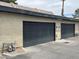 Attached garages with black doors at 3278 Liahona Way, Las Vegas, NV 89121
