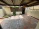 Tiled, covered patio featuring a bar area and greenery at 3278 Liahona Way, Las Vegas, NV 89121