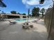 Community pool surrounded by lounge chairs and lush greenery at 3278 Liahona Way, Las Vegas, NV 89121