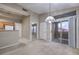 Open-concept living area with eat-in kitchen, high ceilings and outdoor access at 3351 Indian Shadow St # 204, Las Vegas, NV 89129