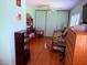 Cozy bedroom with wood-style flooring, closet doors, and ample natural light at 3368 Saddleback Ct, Las Vegas, NV 89121