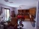 Open dining area with shelving, dining table and bar seating at 3368 Saddleback Ct, Las Vegas, NV 89121