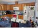 The kitchen features wood cabinets, white appliances, and a breakfast bar area at 3368 Saddleback Ct, Las Vegas, NV 89121