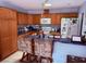 Spacious kitchen with wood cabinetry, updated appliances, and counter seating at 3368 Saddleback Ct, Las Vegas, NV 89121