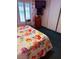 Comfortable main bedroom showcasing a mounted tv, closet and floral bedding at 3368 Saddleback Ct, Las Vegas, NV 89121