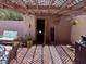 Cozy covered patio area with charming string lights and relaxed seating at 3368 Saddleback Ct, Las Vegas, NV 89121