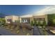 Modern home with desert landscaping, including cacti, succulents, and decorative rock at 7047 Nomi Ct, Las Vegas, NV 89120