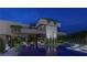 Expansive backyard showcases a modern home with a pool, outdoor living areas, and meticulous landscaping at 3530 Cosima Ln, Las Vegas, NV 89120