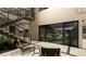 Bright entryway showcasing open staircase, modern furnishings and a view to outdoor living space at 3530 Cosima Ln, Las Vegas, NV 89120
